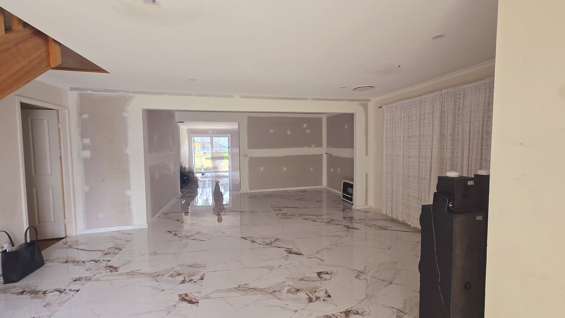 Layered Grandeur before — the space at drywall stage